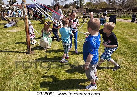 Kids Dancing Round Maypole; Great Chart, Kent, England, Uk View Large Photo Image Stock Image - Kids Dancing Round Maypole; Great Chart, Kent, England, Uk. Fotosearch