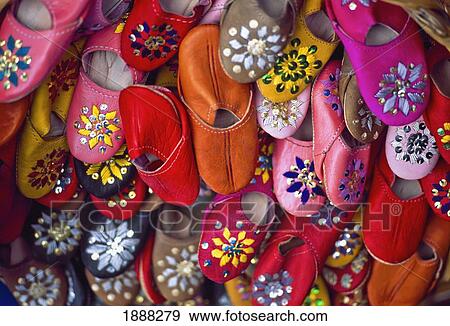 Stock Photo - Kid's Slippers On Market Stall. Fotosearch