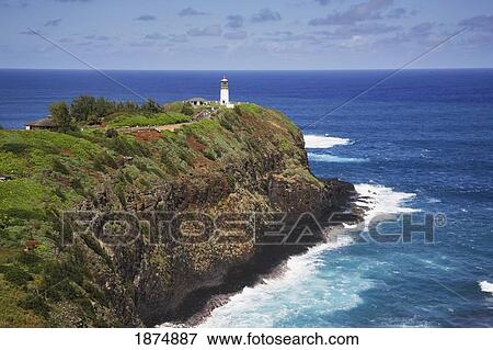 Stock Photo - Kilauea Lighthouse On The End Of A Rocky Ridge Jutting Out Into The Pacific Ocean, With Surf Below; Hawaii, Usa. Fotosearch