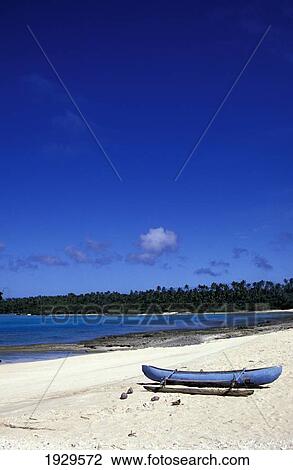 Kingdom of Tonga, Ha'apai, Traditional Outrigger Canoe Drawn up on Shore of Lagoon; Island of Foa View Large Photo Image Stock Image - Kingdom of Tonga, Ha'apai, Traditional Outrigger Canoe Drawn up on Shore of Lagoon; Island of Foa. Fotosearch