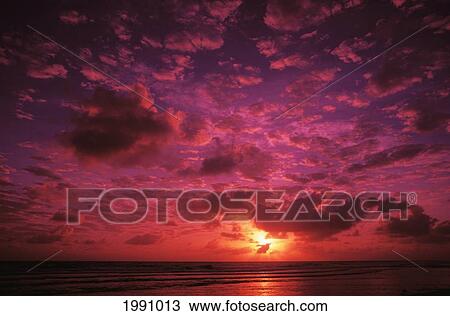 Stock Image - Kiribati, Kiritimati (Christmas Island), Colorful Sunset Over The Ocean. Fotosearch