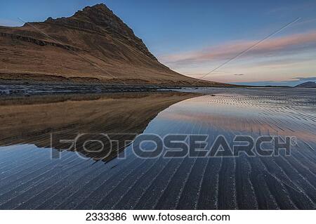 Stock Photograph - Kirkjufell Reflected In A Tidal Pool At Sunrise; Snaefellsnes Peninsula, Iceland. Fotosearch