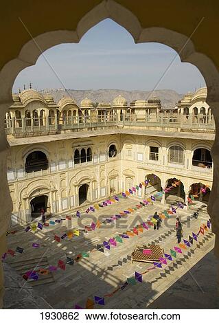 Stock Image - Kite art installation during former Jaipur Heritage Festival, viewed through scalloped arch at Ramchandraji Temple, Jaipur, Rajasthan, India, Jaipur, Rajasthan, India.. Fotosearch