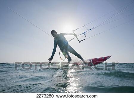 Kitesurfer illuminated by the sunlight; tarifa cadiz andalusia spain View Large Photo Image Stock Image - Kitesurfer illuminated by the sunlight; tarifa cadiz andalusia spain. Fotosearch
