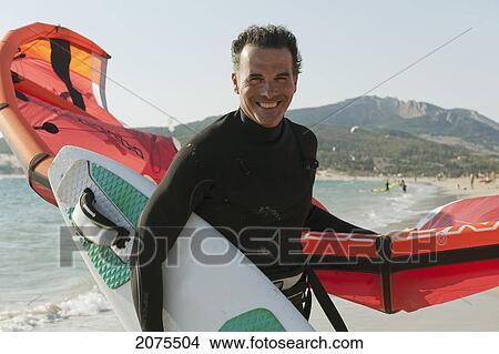 Picture - Kitesurfer On The Beach; Tarifa Cadiz Andalusia Spain. Fotosearch