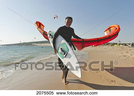 Stock Photography - Kitesurfer On The Beach; Tarifa Cadiz Andalusia Spain. Fotosearch