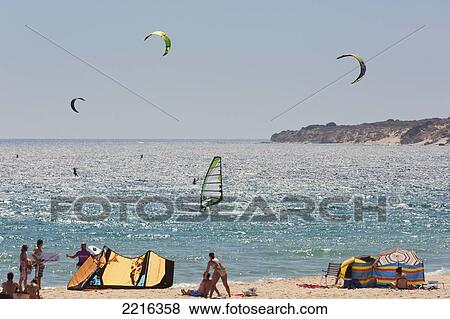 Stock Photo - Kitesurfing And Windsurfing Off The Valdevaqueros Beach; Tarifa Cadiz Andalusia Spain. Fotosearch