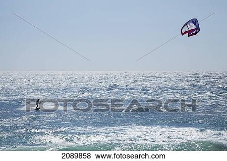 Stock Photo - Kitesurfing; Andalusia, Spain. Fotosearch