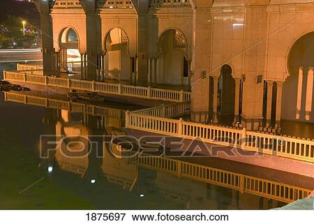 Kuala Lumpur, Malaysia; A Building With Balconies Around It Illuminated At Night View Large Photo Image Stock Photo - Kuala Lumpur, Malaysia; A Building With Balconies Around It Illuminated At Night. Fotosearch