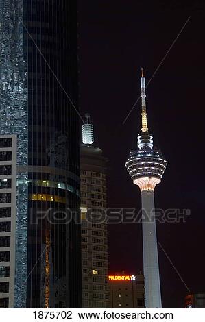 Stock Image - Kuala Lumpur, Malaysia; The Kuala Lumpur Tower Illuminated At Night. Fotosearch