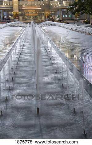 Stock Photo - Kuala Lumpur, Malaysia; Water Fountains In Front Of A Building. Fotosearch