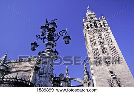 La Giralda Cathedral And Lamp Post, Low Angle View View Large Photo Image Stock Photo - La Giralda Cathedral And Lamp Post, Low Angle View. Fotosearch