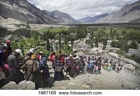 Ladakhi People And Buddhist Monks Walking Down The Mountain In A Line View Large Photo Image Stock Photo - Ladakhi People And Buddhist Monks Walking Down The Mountain In A Line. Fotosearch