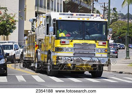 Stock Photo - Ladder Firetruck responding to incident in Waikiki; Oahu, Hawaii, United States of America. Fotosearch