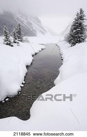 Stock Photography - Lake Louise In Winter In Banff National Park; Banff Alberta Canada. Fotosearch