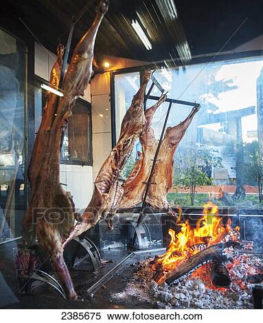 Lambs roasting on spit; El Calafate, Argentina View Large Photo Image Stock Photography - Lambs roasting on spit; El Calafate, Argentina. Fotosearch