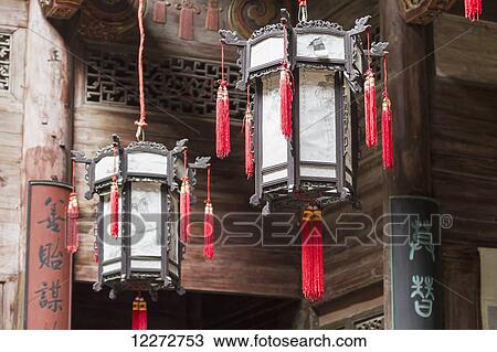 Stock Image - Lamps hanging from the ceiling of Chengzhi Hall, Hongcun, Anhui, China. Fotosearch