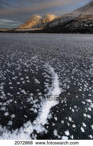 Landscape Of Frozen Lake In Winter, Kusawa Lake Territorial Park, Yukon, Canada View Large Photo Image Stock Photo - Landscape Of Frozen Lake In Winter, Kusawa Lake Territorial Park, Yukon, Canada. Fotosearch