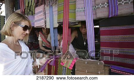 Stock Image - Laos, Champasak Province Bolaven Plateau Hill Tribe Fabrics Tourist Stall. Fotosearch