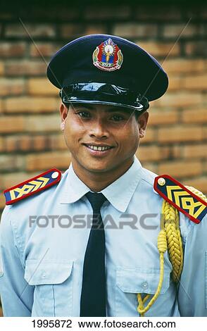 Laos, Luang Prabang, Portrait Of A Uniformed Security Guard. View Large Photo Image Stock Image - Laos, Luang Prabang, Portrait Of A Uniformed Security Guard.. Fotosearch
