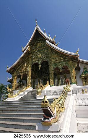 Stock Photograph - Laos, Luang Prabang, Wat Sen, decorative dragon statue(foreground). Fotosearch