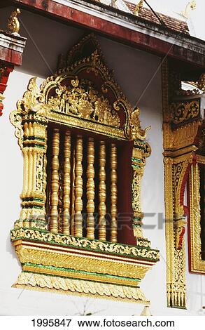 Laos, Luang Prabang, Wat Xien Thong, Intricately Carved Temple Window. View Large Photo Image Stock Photo - Laos, Luang Prabang, Wat Xien Thong, Intricately Carved Temple Window.. Fotosearch