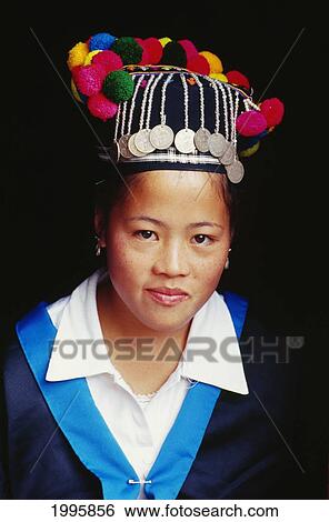 Stock Photograph - Laos, Portrait Of Woman Wearing Traditional Headdress.. Fotosearch