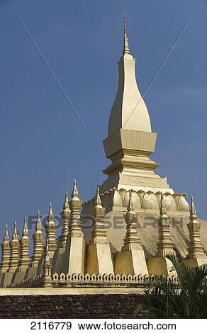 Laos, Vientiane, Pha That Luang, Architectural detail of a golden rooftop. View Large Photo Image Stock Photo - Laos, Vientiane, Pha That Luang, Architectural detail of a golden rooftop.. Fotosearch