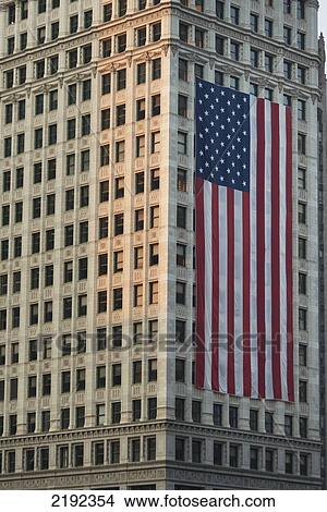 Picture - Large American Flag Hanging On The Side Of A Building; Chicago Illinois United States Of America. Fotosearch
