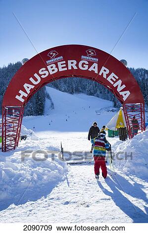 Stock Photo - Large Banner For The Ski Run Named Hausbergarena At Ski And Snowboard Resort In Waidring, Austrian Alps, Austria. Fotosearch