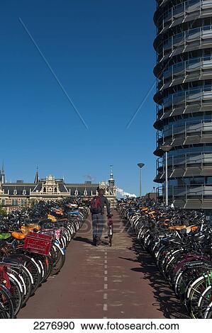 Large bike parking area beside Central Station; Amsterdam, Holland View Large Photo Image Stock Image - Large bike parking area beside Central Station; Amsterdam, Holland. Fotosearch