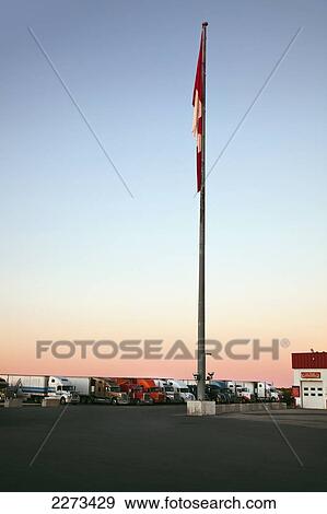 Large canadian flag with no wind; dryden ontario canada View Large Photo Image Stock Photo - Large canadian flag with no wind; dryden ontario canada. Fotosearch