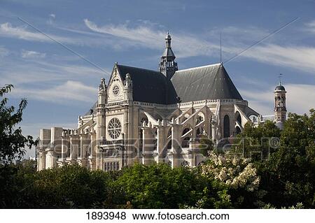 Large Church Surrounded By Trees With Blue Sky And Clouds; Paris, France View Large Photo Image Stock Photo - Large Church Surrounded By Trees With Blue Sky And Clouds; Paris, France. Fotosearch