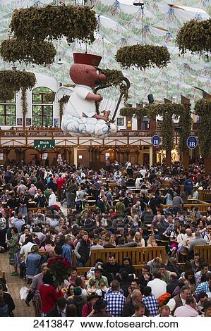 Stock Photo - Large crowd in a festival tent; Munich, Germany. Fotosearch