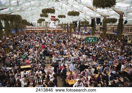 Stock Photograph - Large crowd in a festival tent; Munich, Germany. Fotosearch