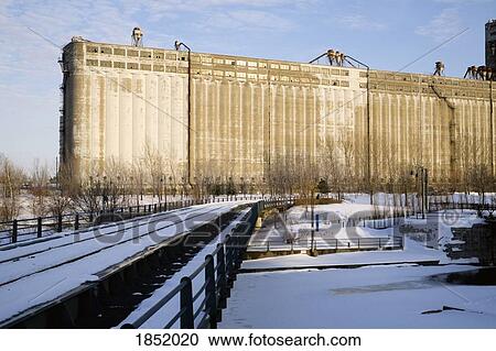 Stock Image - Large Grain Silo On Waterfront. Fotosearch