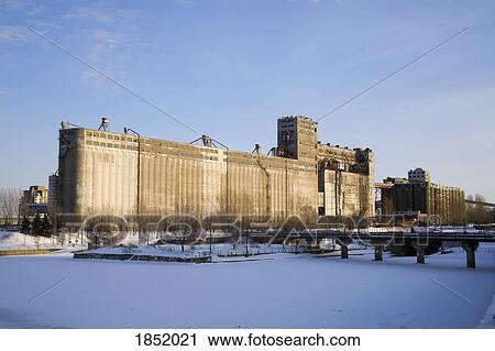 Stock Image - Large Grain Silo On Waterfront. Fotosearch
