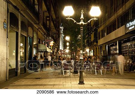 Large Group Of People At Traditional Tapas Bar And Terraces In Abando, Bilbao, Basque Country, Spain View Large Photo Image Stock Photograph - Large Group Of People At Traditional Tapas Bar And Terraces In Abando, Bilbao, Basque Country, Spain. Fotosearch