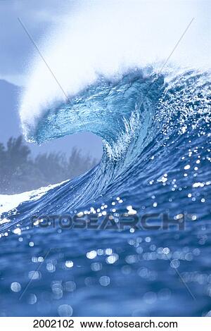 Large Shimmery Blue Wave Curling With Wind Spray, Land Visible In Background View Large Photo Image Stock Image - Large Shimmery Blue Wave Curling With Wind Spray, Land Visible In Background. Fotosearch
