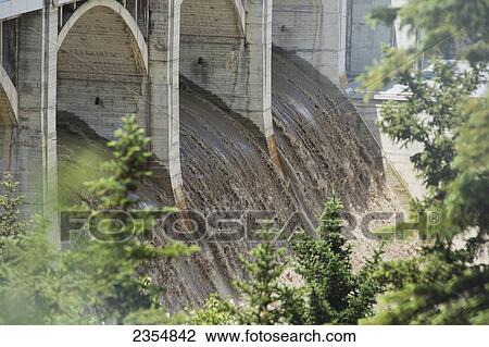 Stock Image - Large Volume Of Water Flowing After A Flood; Calgary, Alberta, Canada. Fotosearch