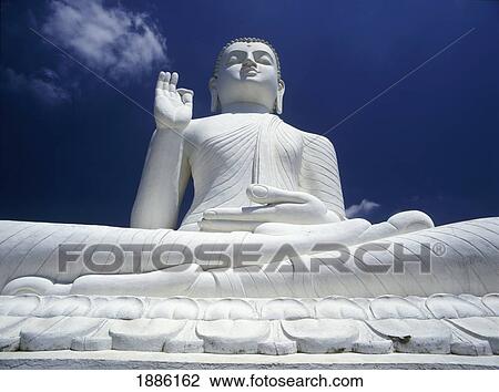 Stock Image - Large White Buddha Statue At Mihinitale. Fotosearch