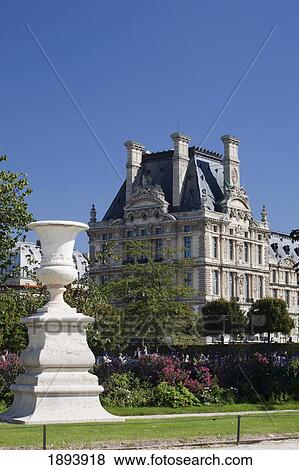 Large White Vase In A Garden With A Building Of French Architecture In The Background; Paris, France View Large Photo Image Stock Photo - Large White Vase In A Garden With A Building Of French Architecture In The Background; Paris, France. Fotosearch