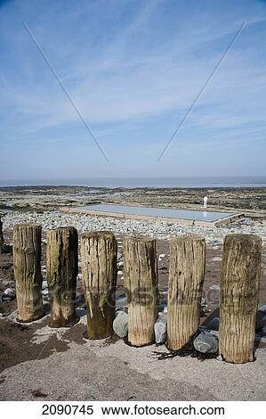 Stock Photography - Large Wooden Struts Acting As Tidal Breaks At The High Tide Mark In Watchet, Exmoor National Park, Somerset, Uk. Fotosearch