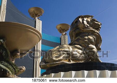 Stock Image - Las Vegas, Nevada, United States Of America; Lion Statue And Male Figures Holding Bowls. Fotosearch