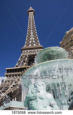 Stock Photo - Las Vegas, Nevada, United States Of America; Eiffel Tower And A Water Fountain With A Statue. Fotosearch
