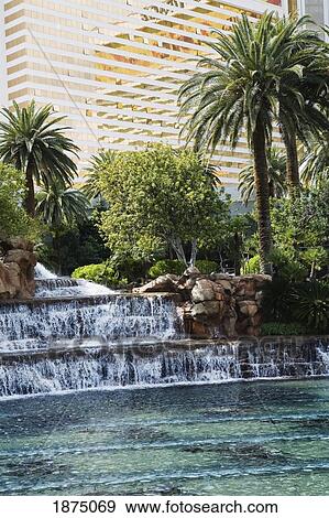 Las Vegas, Nevada, United States Of America; Waterfalls, Pools, Palm Trees And Windows Of A Hotel View Large Photo Image Stock Photo - Las Vegas, Nevada, United States Of America; Waterfalls, Pools, Palm Trees And Windows Of A Hotel. Fotosearch