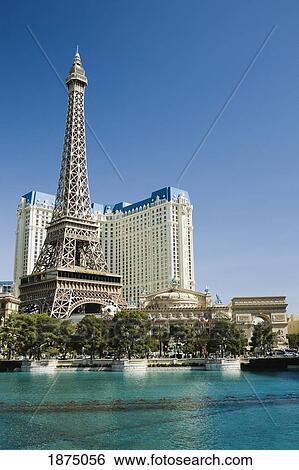 Stock Photograph - Las Vegas, Nevada, United States Of America; Eiffel Tower With The Bellagio's Water Fountain Pool. Fotosearch