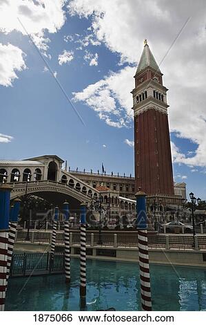 Stock Photograph - Las Vegas, Nevada, United States Of America; San Marco's Tower With Rialto Bridge, Striped Poles And A Canal. Fotosearch