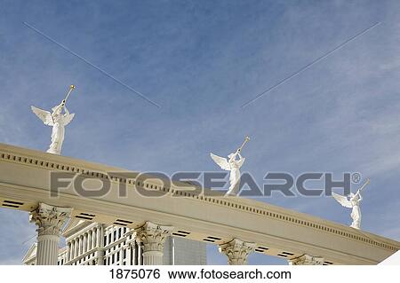 Las Vegas, Nevada, United States Of America; Statues Of Angels With Trumpets On Top Of Columns In A Hotel Entrance Way View Large Photo Image Stock Photograph - Las Vegas, Nevada, United States Of America; Statues Of Angels With Trumpets On Top Of Columns In A Hotel Entrance Way. Fotosearch