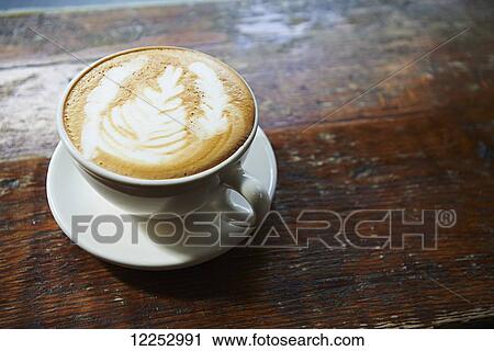 Stock Image - Latte in Lower East Side Coffee shop, Manhattan; New York City, New York, United States of America. Fotosearch